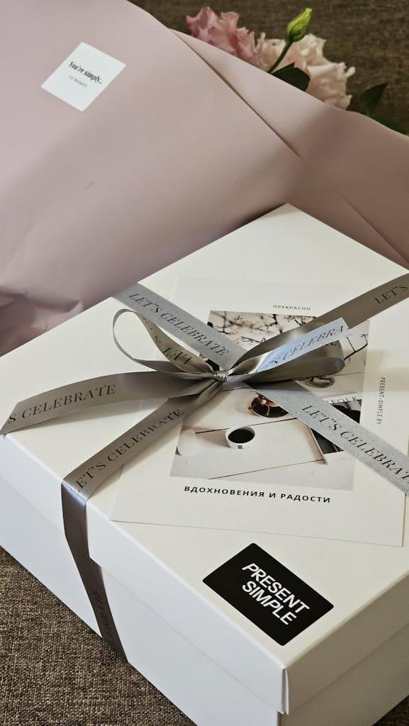 Sophisticated gift box wrapped with a silver ribbon, ideal for special occasions.