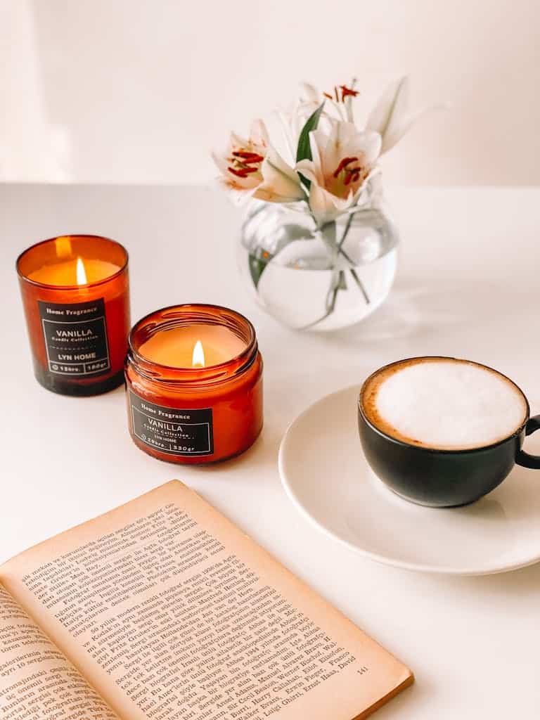 Cozy reading gifts for book lovers like scented candles, mug and artisanal coffee